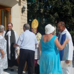 Greeting members of the congregation after the service